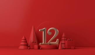 Gold number 12 placed on a holiday festive red background
